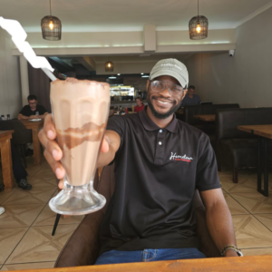 Que, barista at our lovely restaurant with tasty food in Port Elizabeth